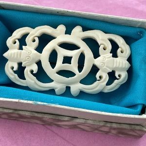 Vintage carved bone or ivory brooch